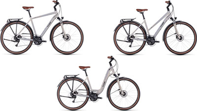 Tre biciclette Cube Touring Pro affiancate: una con telaio a diamante, una con telaio trapezoidale e una con telaio ribassato.