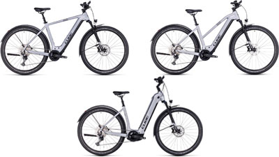 Sono esposte tre e-bike Cube Nuride Hybrid bianche, ciascuna con un telaio a diamante, un telaio trapezoidale e un telaio a scavalco basso.